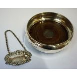 A Silver Wine Coaster, Hallmarks for Birmingham, with a wood interior, 10cm diameter, also with a