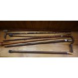 Seven Assorted Walking Sticks, circa early 20th century, to include a military type stick, (7)