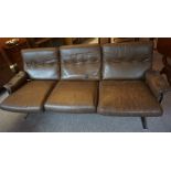 A Retro Brown Three Seater Leather Sofa, Raised on chrome supports, 70cm high, 180cm wide