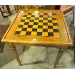 A Modern Games Table, With a detachable chess board top above a backgammon interior, 71 x 69cm