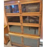 An Oak Stacking Bookcase, Wth four sections containing glazed doors, 146cm high, 90cm wide, 30cm