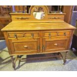 A Vintage Oak Sideboard, With a mirrored pediment above drawers and doors, 130cm high, 120cm wide,