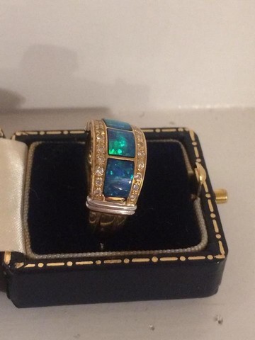 An Unmarked Gold Ladies Dress Ring, Set with three green centre stones possibly opals, surrounded by - Image 2 of 3