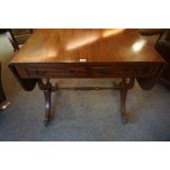 A Mahogany Sofa Table, With two drawers, raised on gilt animal paw sabots and brass castors, 74cm