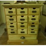 A Pine Filing Chest of Drawers, With twelve matching drawers above a long drawer, 61cm high, 50cm