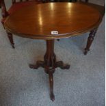 A Victorian Mahogany Tripod Table, With an oval top, 70cm high, 61cm wide