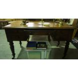 A Victorian Mahogany Desk, With fitted drawers, raised on turned legs with brass castors, 74cm high,
