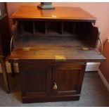 A 19th Century Mahogany Secretaire Cupboard, In the Regency style, with a secretaire drawer
