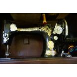 A Vintage Singer Sewing Machine, In original travel case