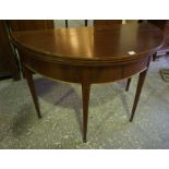 A Mahogany Demi Lune Fold Over Tea Table, Raised on tapered legs, 73cm high, 95cm wide, 92cm long,