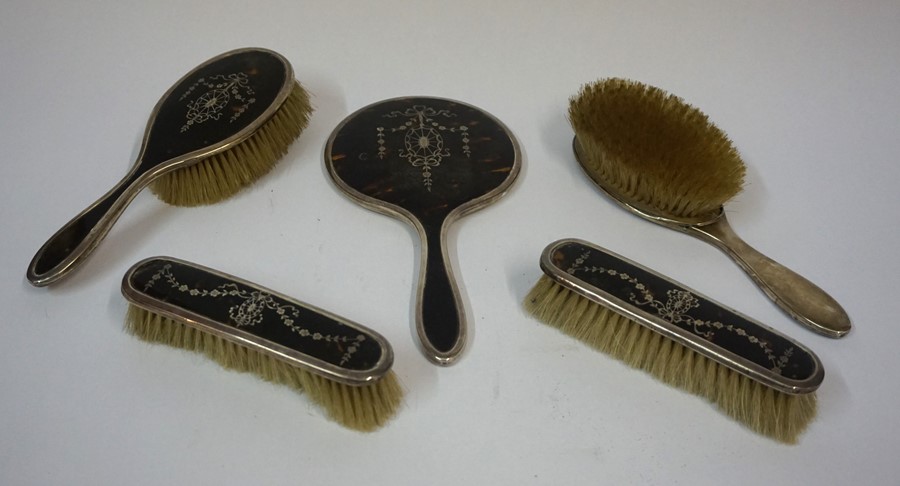 A George V Silver and Tortoiseshell Five Piece Dressing Table Set, Date marks for 1923, comprising