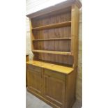 A Large Pine Kitchen Dresser, With open shelving above two drawers and two doors, 215cm high,