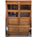 An Oak Stacking Bookcase, With four sections containing glazed and panelled doors, 144cm high,