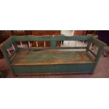 A French Antique Green Painted Pine Hall Settle, With a hinged seat, 88cm high, 204cm wide, 54cm