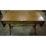 A Walnut Sofa Table, With two small drawers above under stretcher, raised on turned columns and