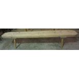 A Pine Bench, With a rectangular plank top, 43cm high, 202cm wide, 29cm deep