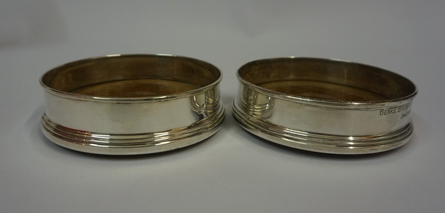 A Mixed Lot of Assorted Silver, To include two silver mounted wine coasters, six napkin rings, two