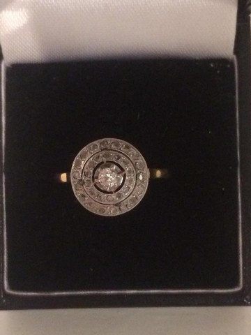An Unmarked Gold Ladies Diamond Dress Ring, With two circles of diamonds, with a single centre