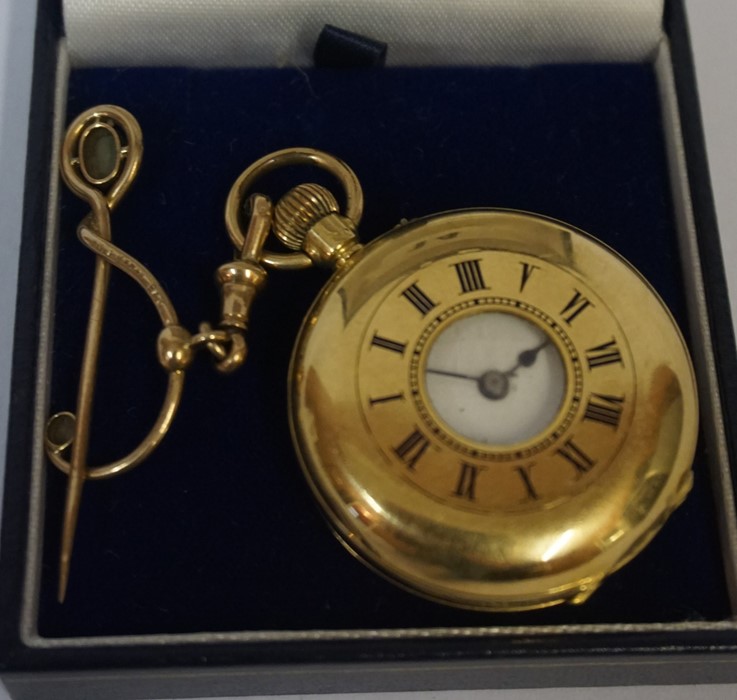 An 18 carat Gold Half Hunter Fob Watch, Stamped 18k, monogrammed to back and engraved to inside,