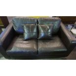 A Modern Brown Leather Two Seater Sofa, 63cm high, 157cm wide, with matching armchair, (2)