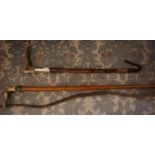 An Antique Riding Crop, circa early 20th century, with a silver collar stamped Swaine, 54cm long,