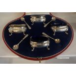 A Silver Four Piece Condiment Set by Hamilton & Inches of Edinburgh, With four spoons, and blue