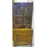 An Oak Cupboard Chest, 72cm high, 69cm wide, 42cm deep, also with an oak glazed cabinet, (2)