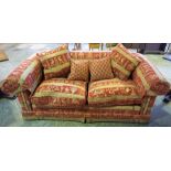 A Large Duresta Two Seater Sofa, Upholstered in red fabric, with cushions, 85cm high, 200cm wide