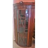 A 19th Century Mahogany Corner Gun Cabinet, With a cartouche to the top carved with two rifles,
