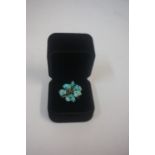 A 18ct Turquoise Dress Ring, Set with twelve suspended turquoise stones, stamped k18, overall weight