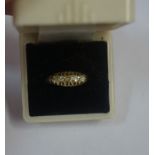 A Gold Diamond Five Stone Ring, Set with five small stones, gold marks rubbed, overall weight 3.5