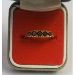 A 9ct Gold and Garnet Five Stone Dress Ring, Set with five small stones, stamped 9c, overall