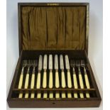 A Set of Twelve Silver Plated Fruit Knives and Forks, In a fitted oak case