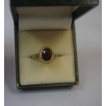 A 9ct Gold and Garnet Dress Ring, circa early 20th century, Set with a large garnet stone, measuring