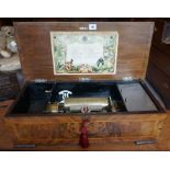 A Large Continental Walnut Cased Music Box, circa early 20th century, enclosing crank lever,