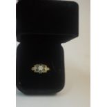 A 9ct Gold and Gem Set Cluster Ring, With five blue gem stones, flanked with diamond chips,