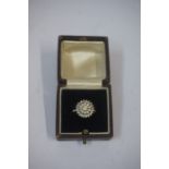 A Diamond Flowerhead Cluster Ring, Set with allover graduated diamond stones, gold marks rubbed,