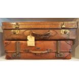 A Leather Suitcase, circa early 20th century, 16cm high, 65cm wide, also with another vintage