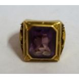 A 10ct Gold and Amethyst Ring, The square cut Amethyst stone measuring approximately 1cm, stamped