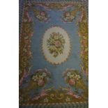 A Pair of Axminster Wool Rugs, Decorated with floral panels on a blue ground, 198cm x 138cm, (2)