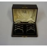 A Pair of Silver Four Bar Toastracks, Hallmarks for Birmingham 1931, overall weight 4.210 oz, in a