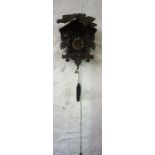 A Black Forest Style Cuckoo Clock, 39cm high, with two weights