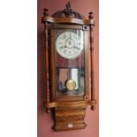 A Victorian Walnut Marquetry Wall Clock, With a twin train dial, 103cm high