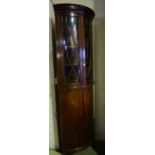 A Mahogany Corner Cabinet on Cupboard Base, circa early 20th century, The top section having an