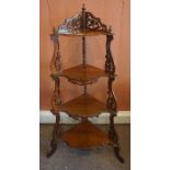 A Victorian Style Walnut Whatnot, 20th century, With open tiers, having fretwork decoration, 125cm