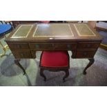 A Kneehole Desk, 20th century, Having fitted drawers, 65cm high, 120cm wide, 53cm deep, with