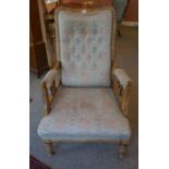 An Arts & Crafts Liberty Style Buttonback Parlour Armchair, Decorated with ying yang style roundels,