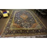 A Large Persian Carpet, Decorated with a large floral medallion, with further floral motifs on a