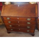 A George III Mahogany Writing Bureau, circa early 19th century, Having a fall front above four