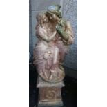 A Large Antique Painted Stone Garden Statue, Modelled as a classical couple in embrace, raised on